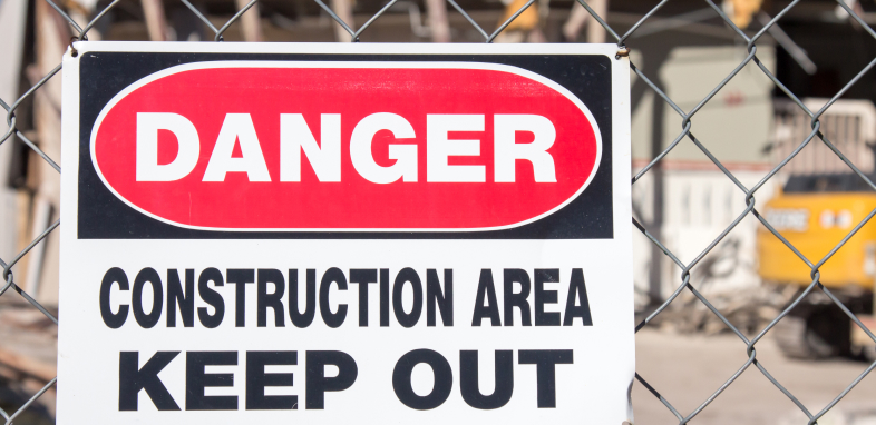 A construction sign that says "danger, keep out", indicating premise liability claims.