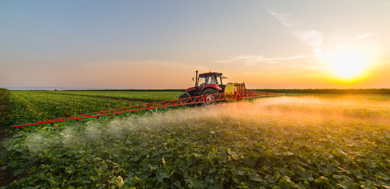 A tractor spraying in a field representing Roundup® lawsuits.