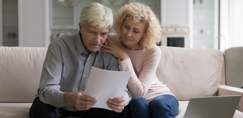 A person comforting a senior reading a denied claim, symbolizing Social Security Disability claim